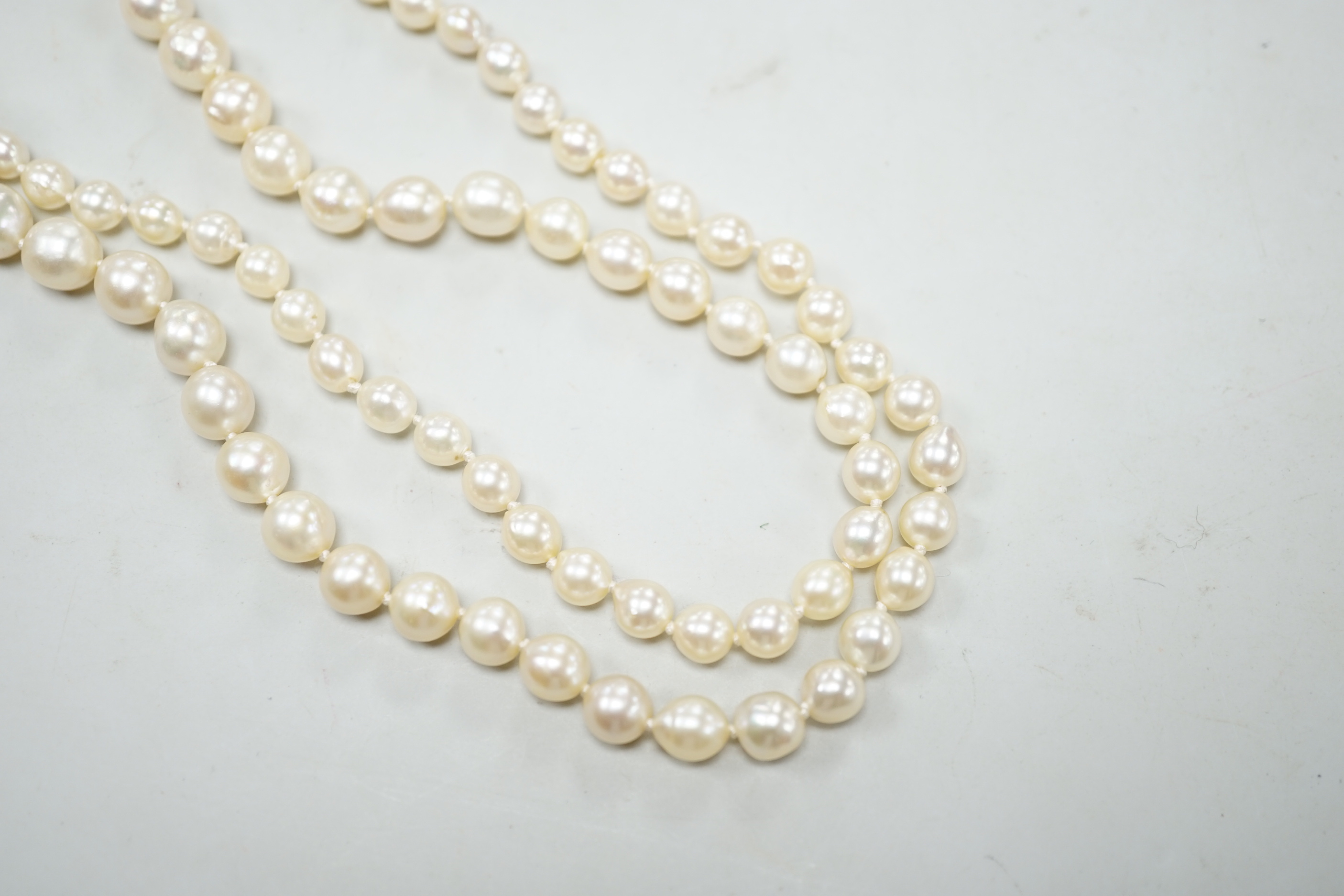 A single strand graduated cultured pearl necklace, now with an earlier 19th century seed pearl and plaited hair set clasp, 76cm, together with original clasp.